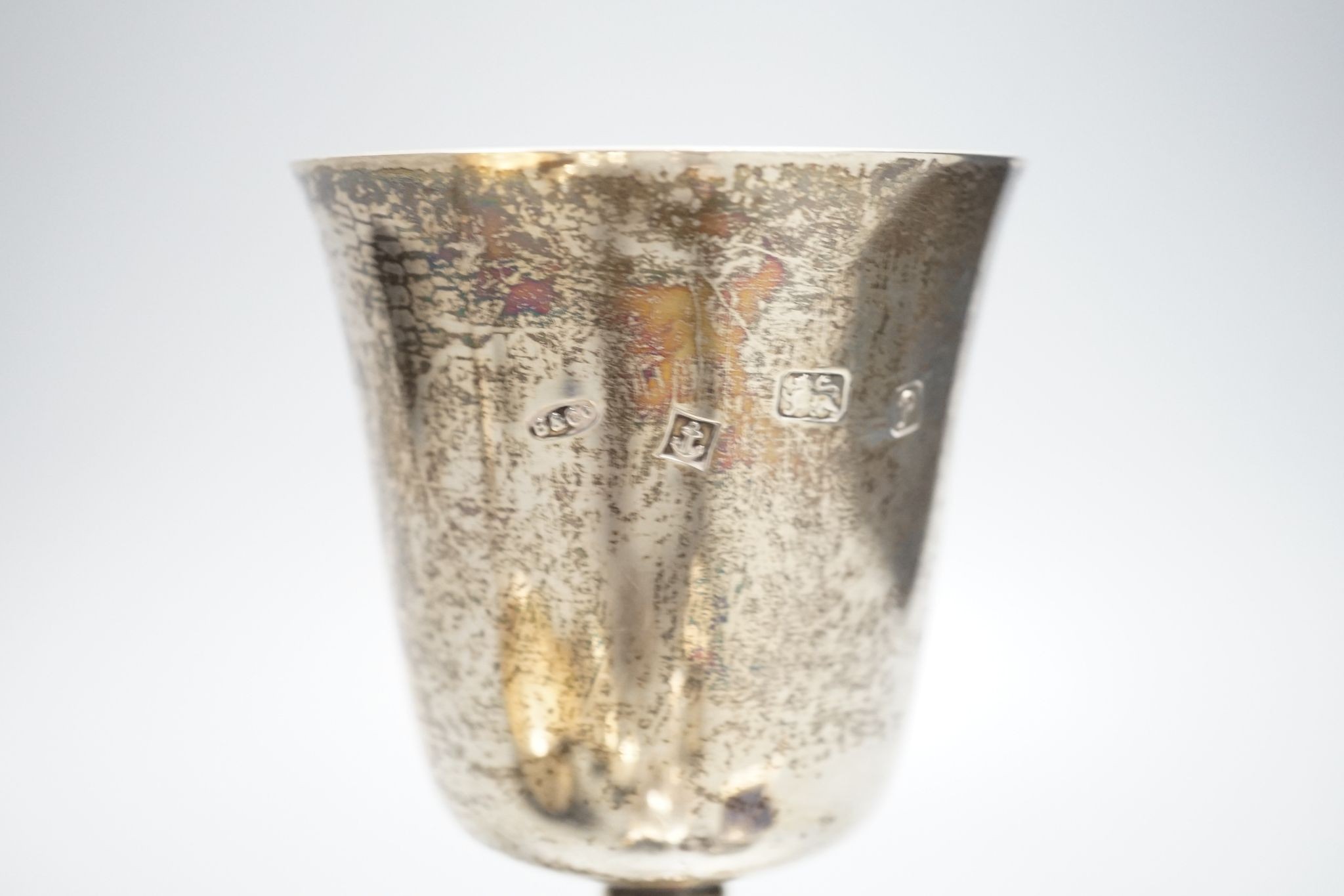 A modern silver goblet, 15.8cm, a silver sauceboat, four silver spoons and three silver condiments, 10.5oz.